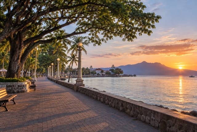 Illustration of a tree-lined seaside boulevard at sunrise in Dumaguete