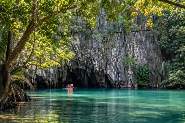 Illustration of a paddle boat at the limestone entrance of the Underground River in Puerto Princesa, Palawan
